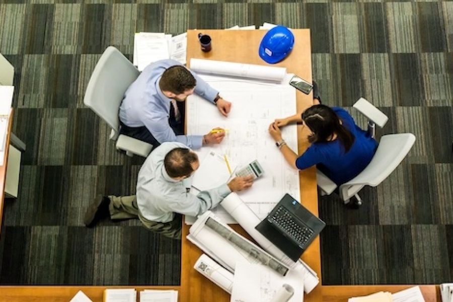 Group of people sitting at a table and planning.