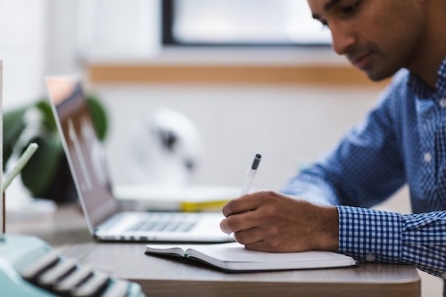 Person sitting at a laptop.