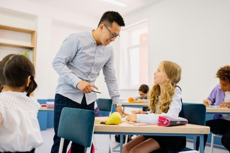 Person helping a student.